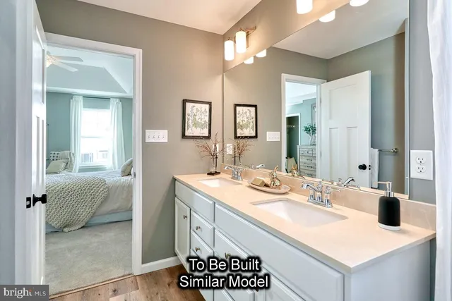 a en suite bathroom with a sink and a mirror