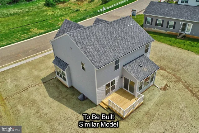 an aerial view of a house with a garden