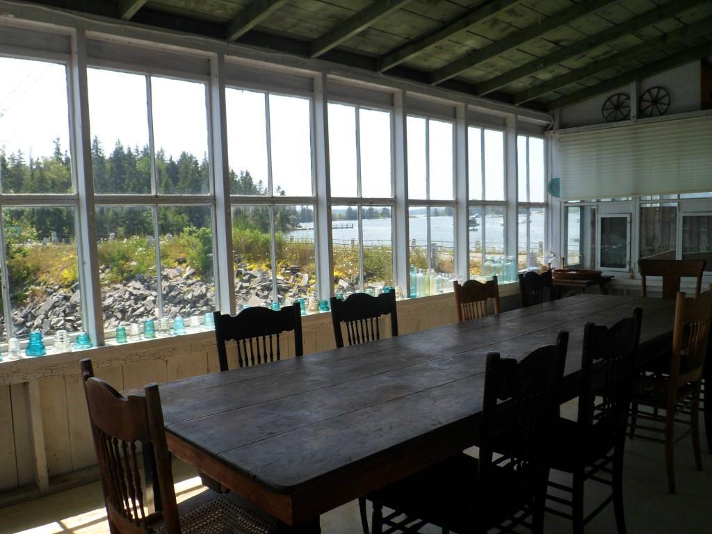 12 Lanes Island Road Vinalhaven, ME 04863 - Photo 11 of 34 Glassed in dining porch sets...