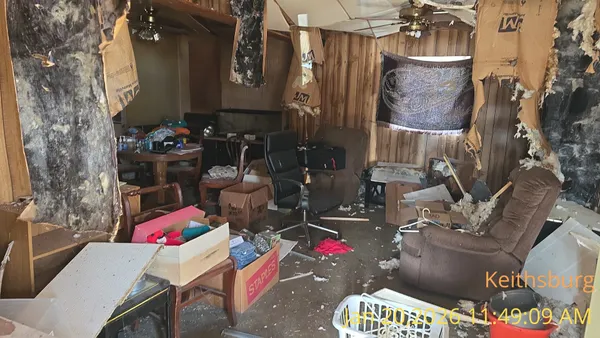 a living room filled with furniture and a table