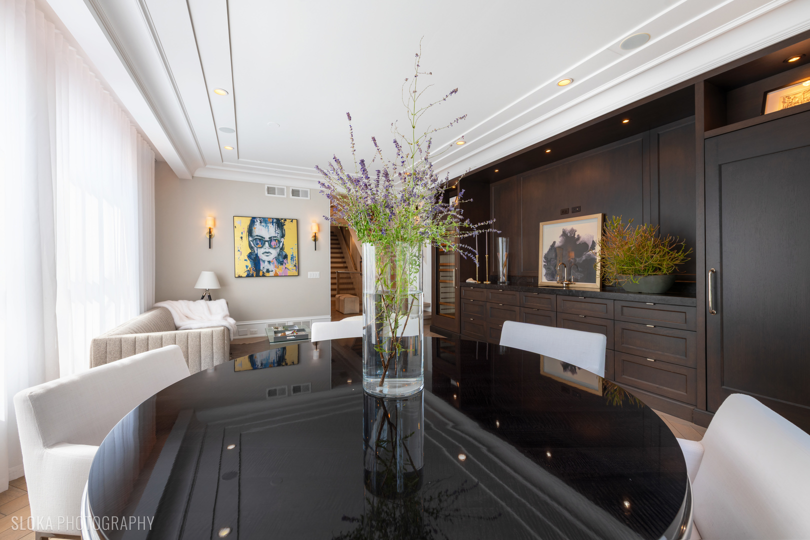 1942 North Sedgwick Street, Unit PH Chicago, IL 60614 - Photo 21 of 84 a living room with furniture a chandelier and a dining room view