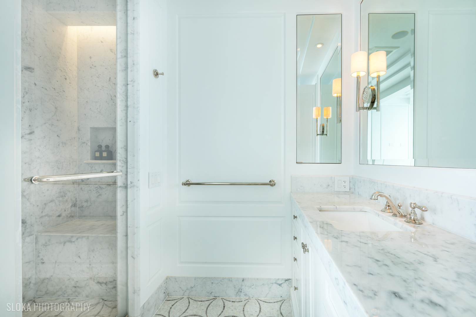 1942 North Sedgwick Street, Unit PH Chicago, IL 60614 - Photo 24 of 84 a bathroom with a granite countertop sink a mirror and a shower
