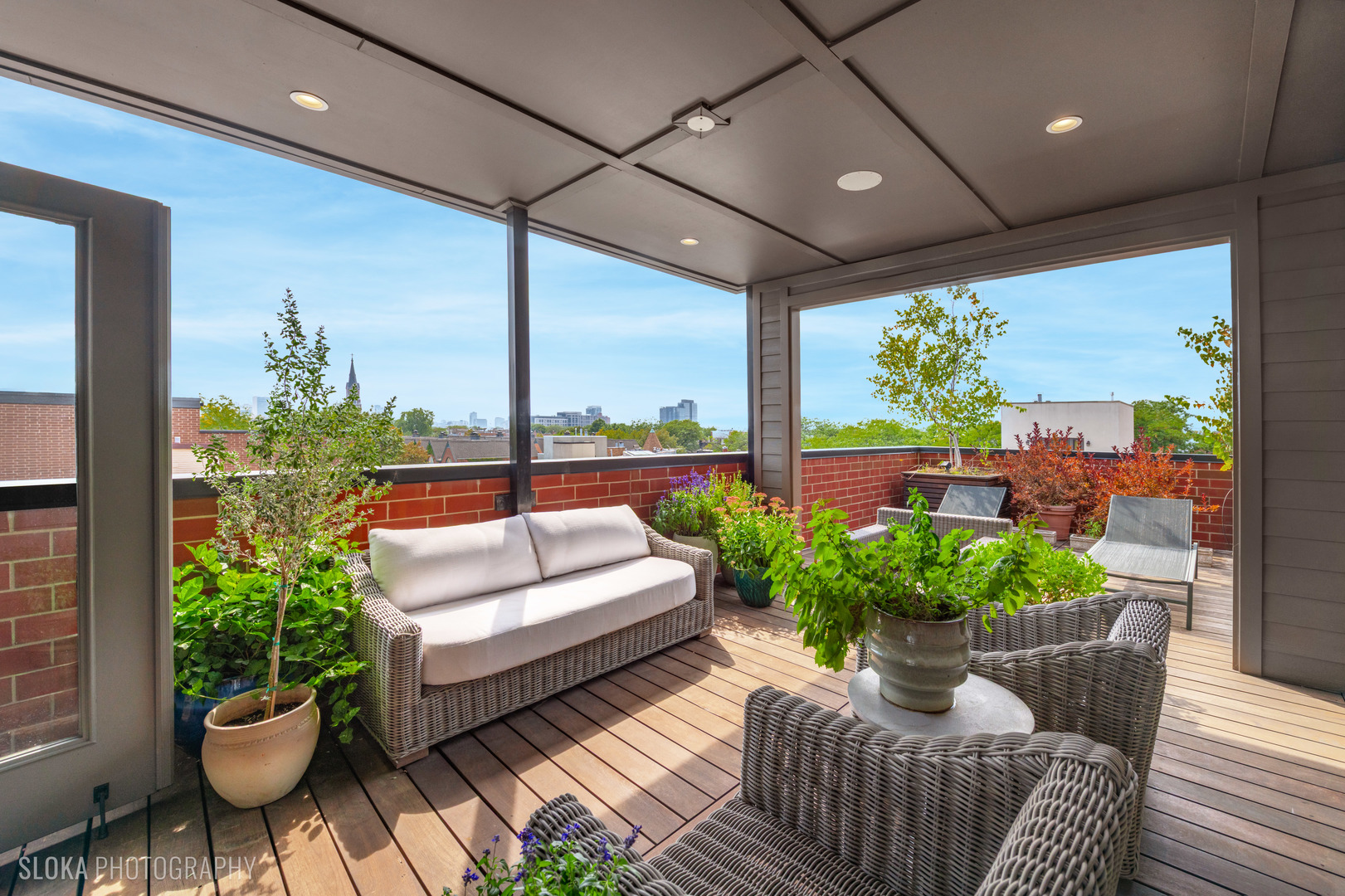 1942 North Sedgwick Street, Unit PH Chicago, IL 60614 - Photo 35 of 84 a view of a patio with couches and potted plants