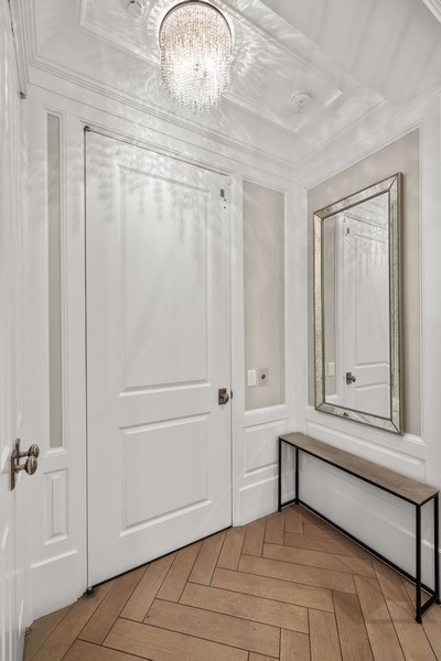 1942 North Sedgwick Street, Unit PH Chicago, IL 60614 - Photo 47 of 84 a view of a livingroom with wooden floor and cabinet