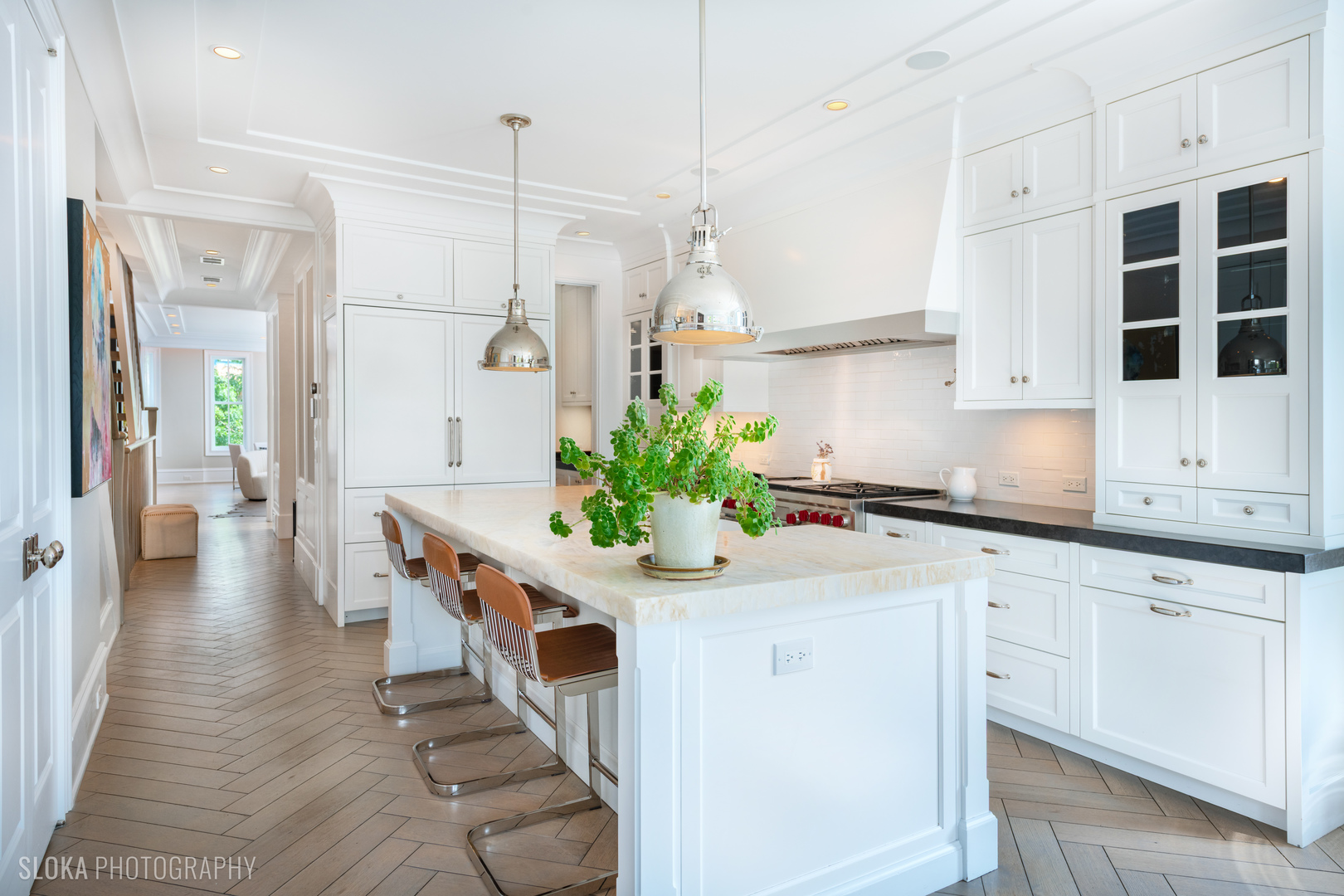 1942 North Sedgwick Street, Unit PH Chicago, IL 60614 - Photo 9 of 84 a kitchen with white cabinets and stainless steel appliances