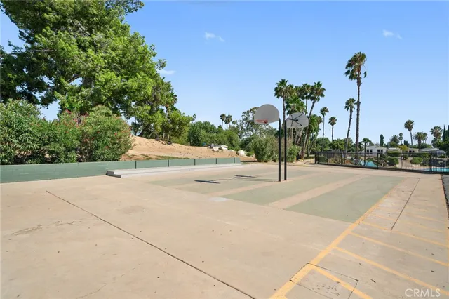 a view of a swimming pool with a yard