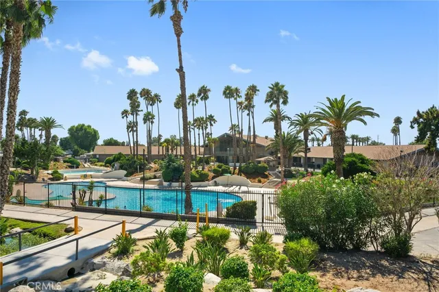 an aerial view of residential houses with outdoor space and river