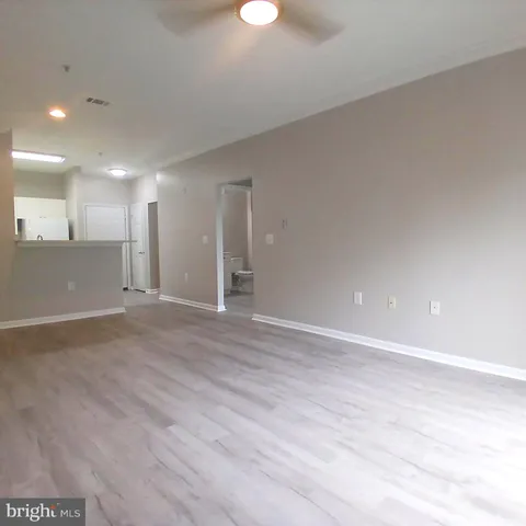a view of an empty room with glass door