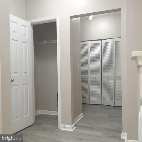 an empty room with wooden floor