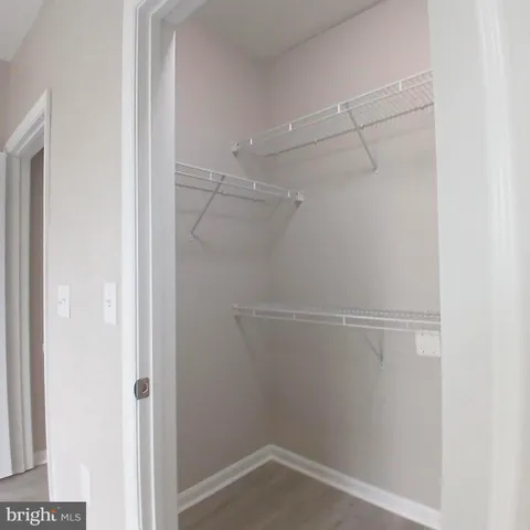 a view of an empty walk in closet