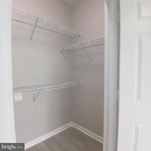 a view of a room with racks on the wall