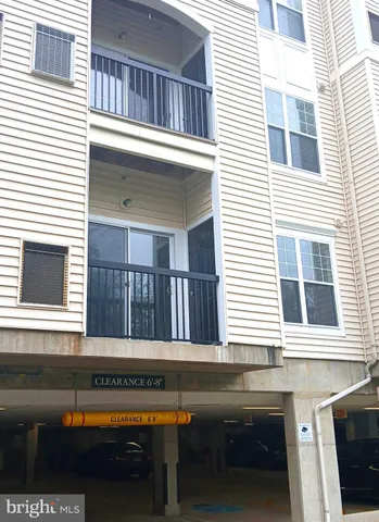 a lobby with furniture and chandelier