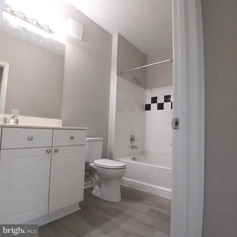a bathroom with a toilet sink and shower