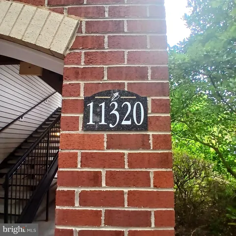 a view of a brick building with an empty space and a window