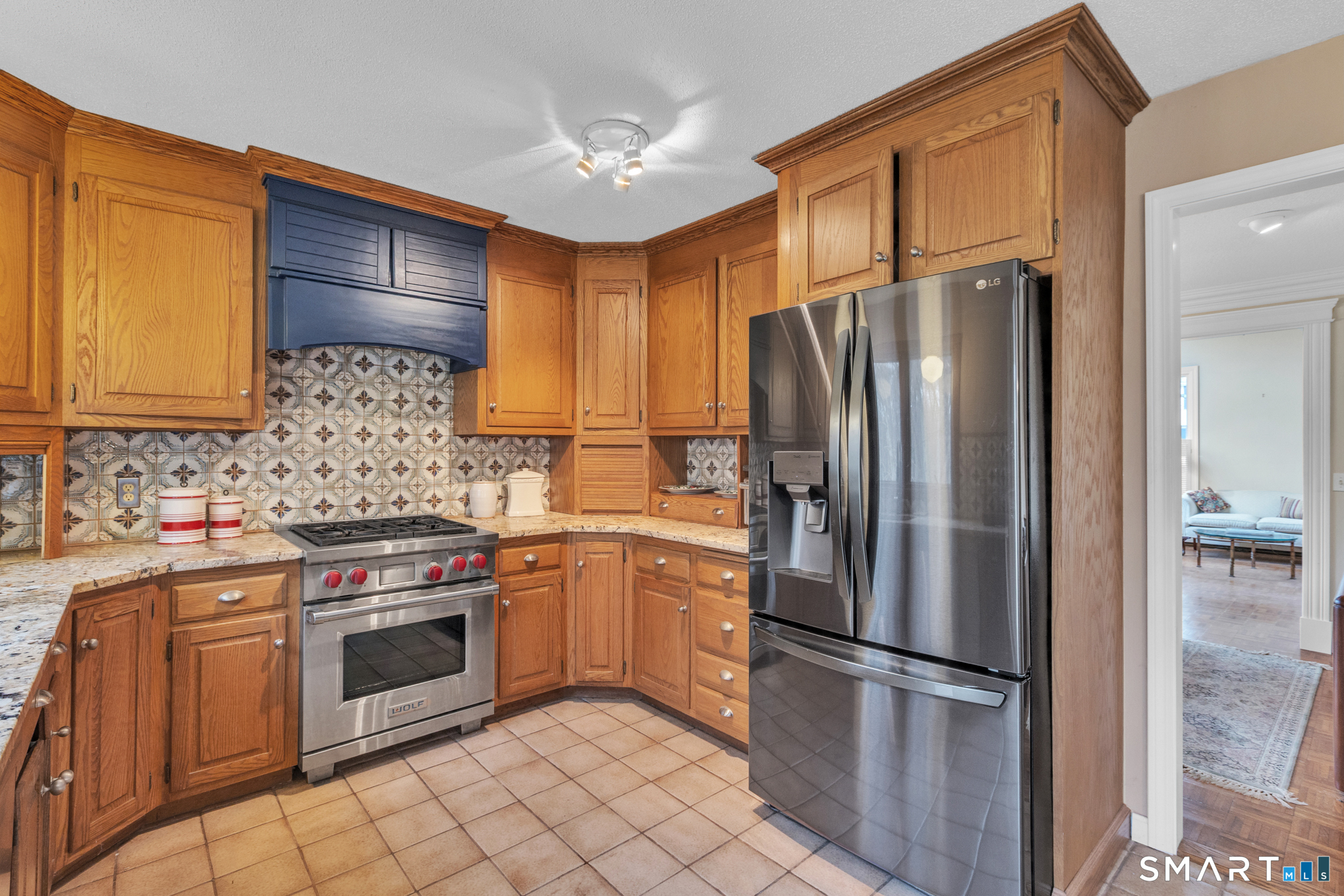 176 Stephen Drive Meriden, CT 06450 - Photo 12 of 34 a kitchen with stainless steel appliances granite countertop a refrigerator sink and stove