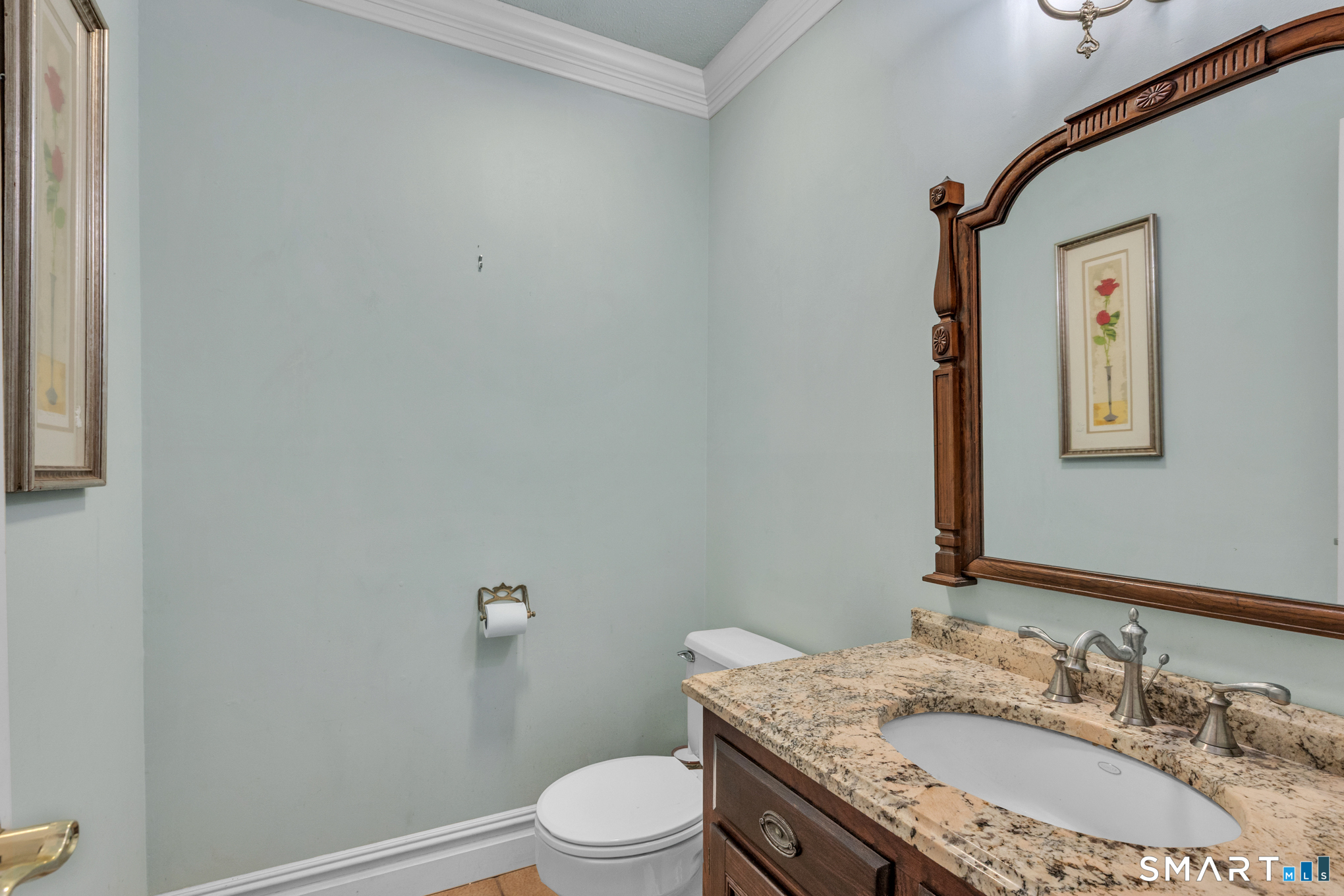 176 Stephen Drive Meriden, CT 06450 - Photo 18 of 34 a bathroom with a granite countertop sink a toilet and mirror