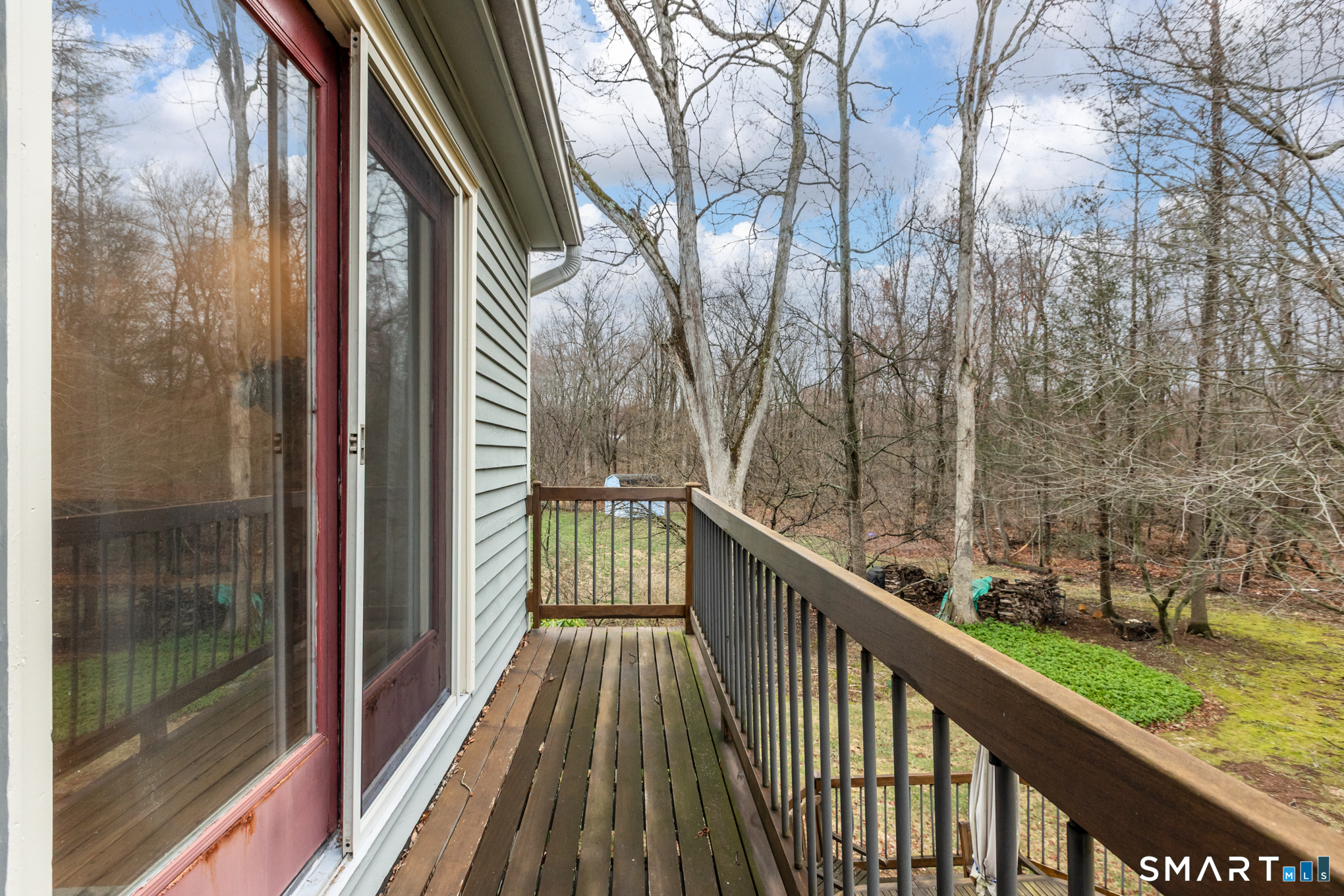 176 Stephen Drive Meriden, CT 06450 - Photo 19 of 34 a view of a balcony with wooden floor and fence