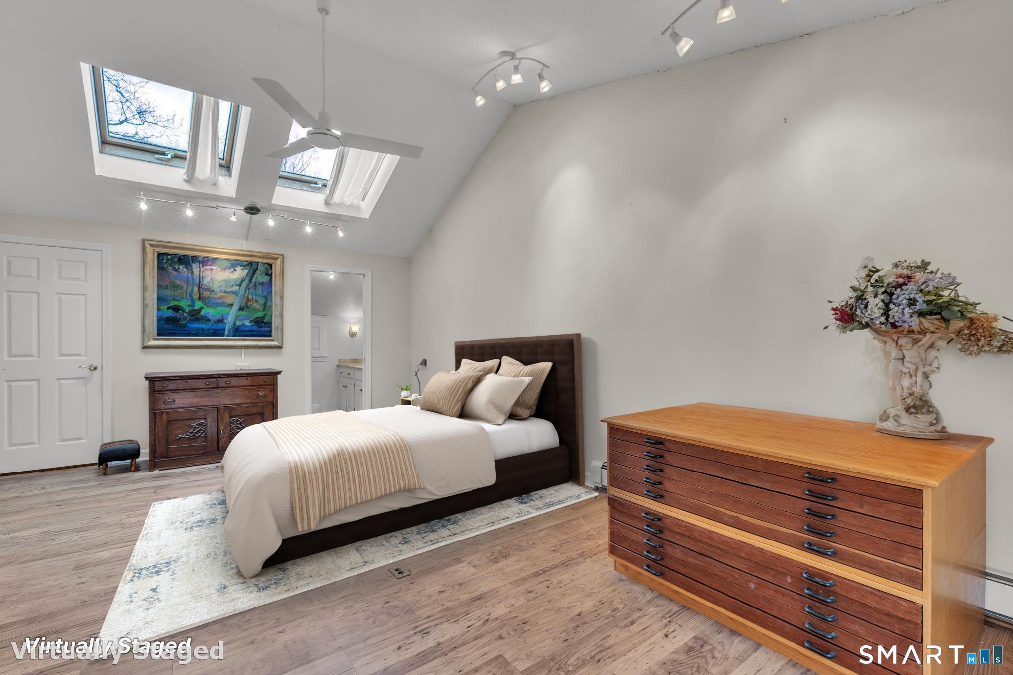 176 Stephen Drive Meriden, CT 06450 - Photo 20 of 34 a bedroom with a bed lamps and fireplace