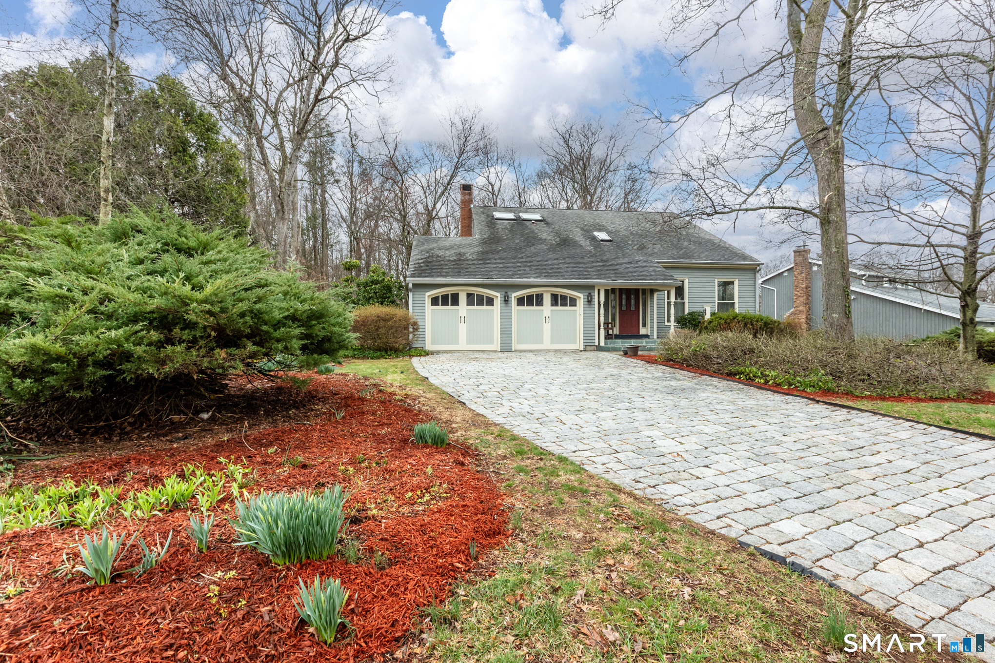 176 Stephen Drive Meriden, CT 06450 - Photo 2 of 34 a front view of a house with a garden