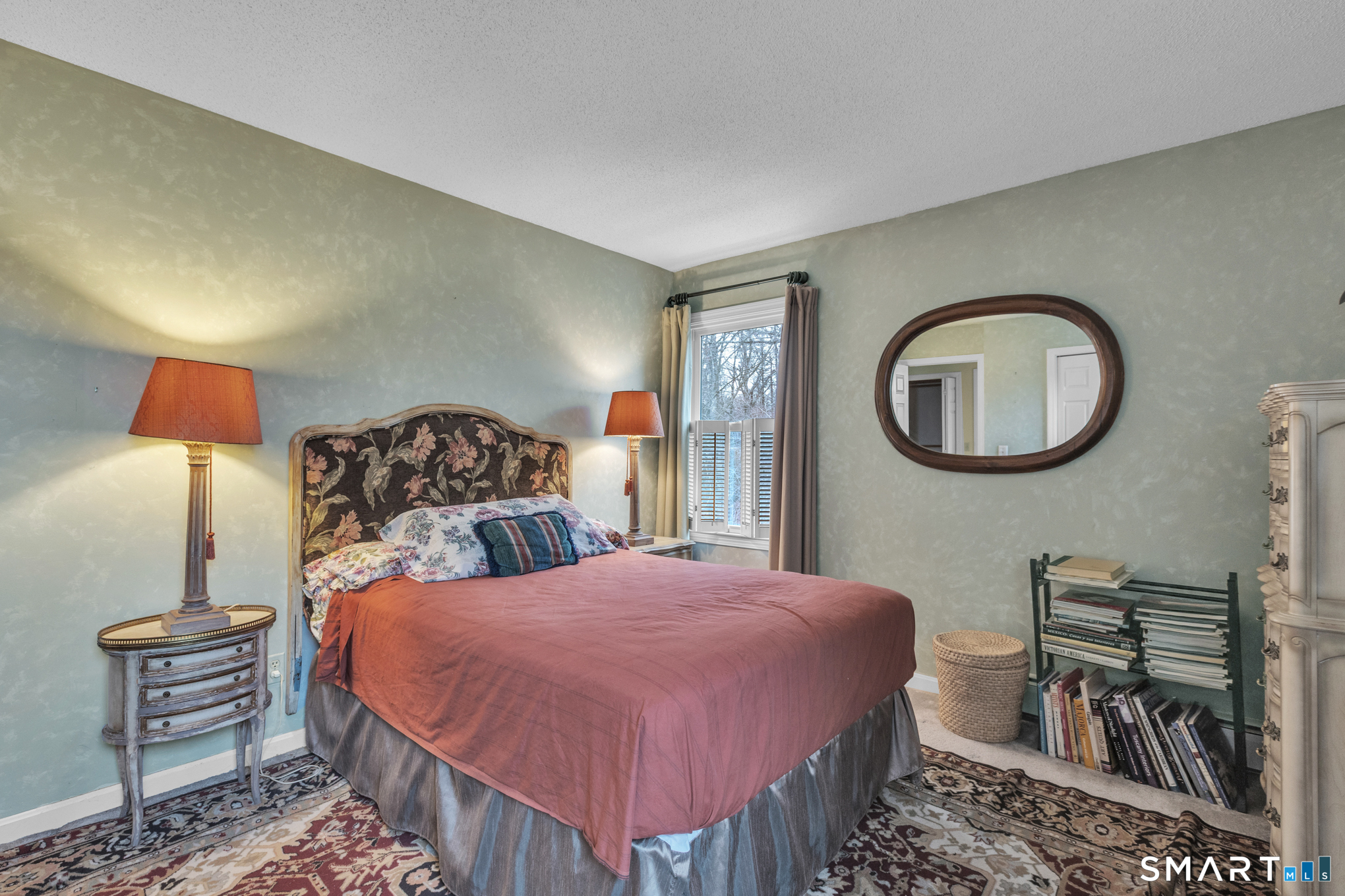 176 Stephen Drive Meriden, CT 06450 - Photo 26 of 34 a bedroom with a bed a mirror and lamp