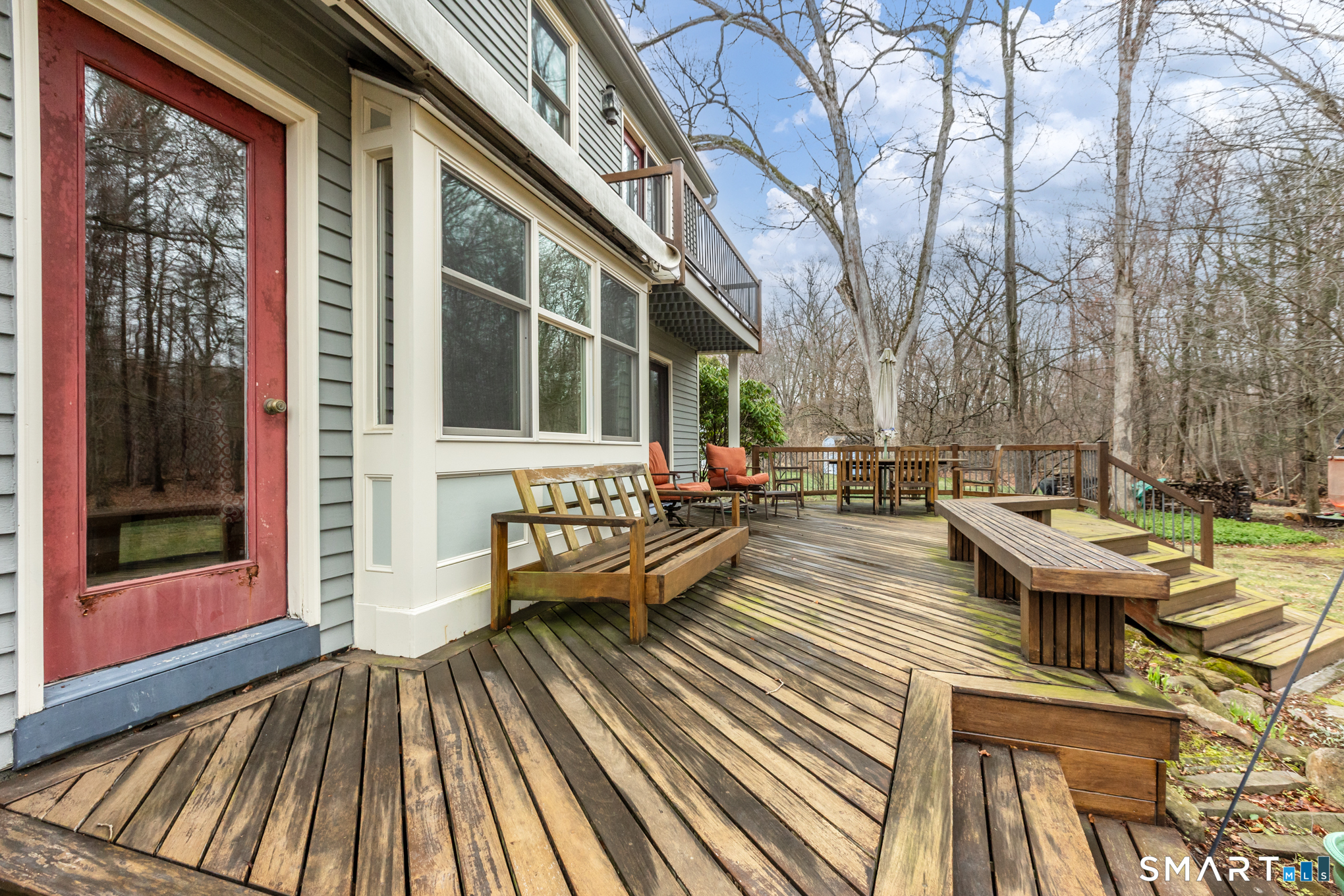 176 Stephen Drive Meriden, CT 06450 - Photo 5 of 34 a balcony with wooden floor and glass door