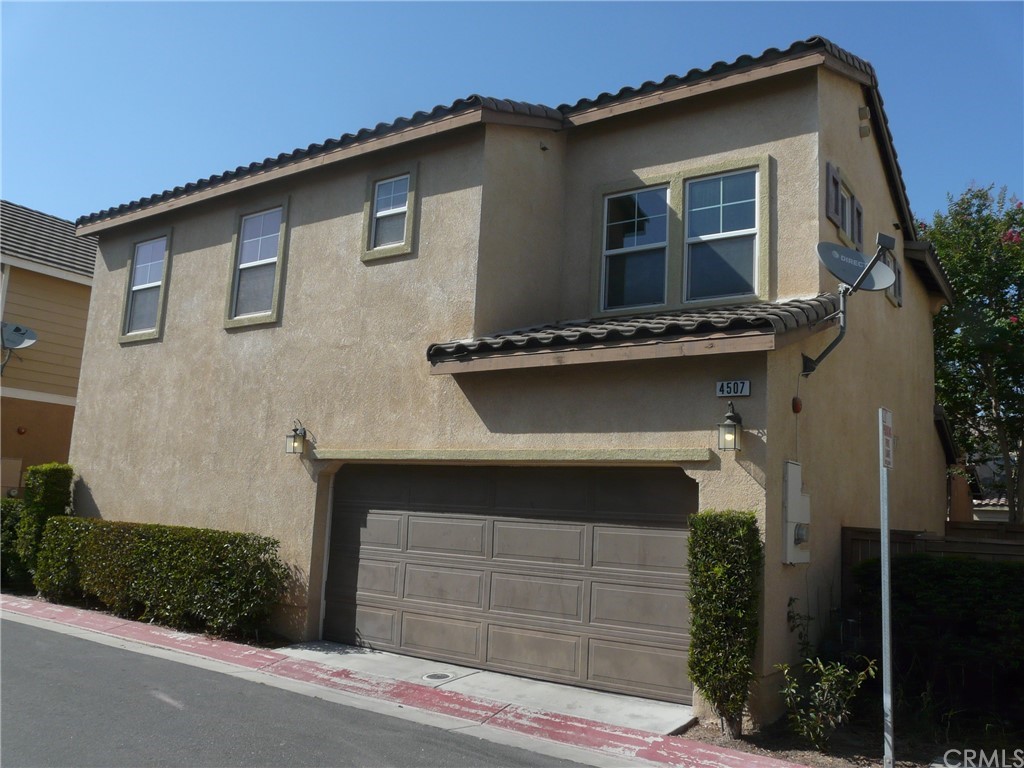 4507 Bluet Court Riverside, CA 92501 - Photo 1 of 1 a front view of a house with garage