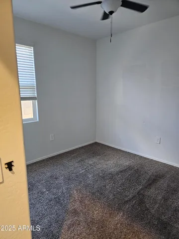 a bathroom with a double vanity sink toilet and a mirror