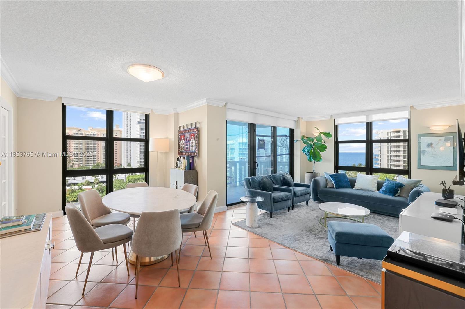 1121 Crandon Boulevard, Unit E802 Key Biscayne, FL 33149 - Photo 4 of 31 a living room with furniture and a large window
