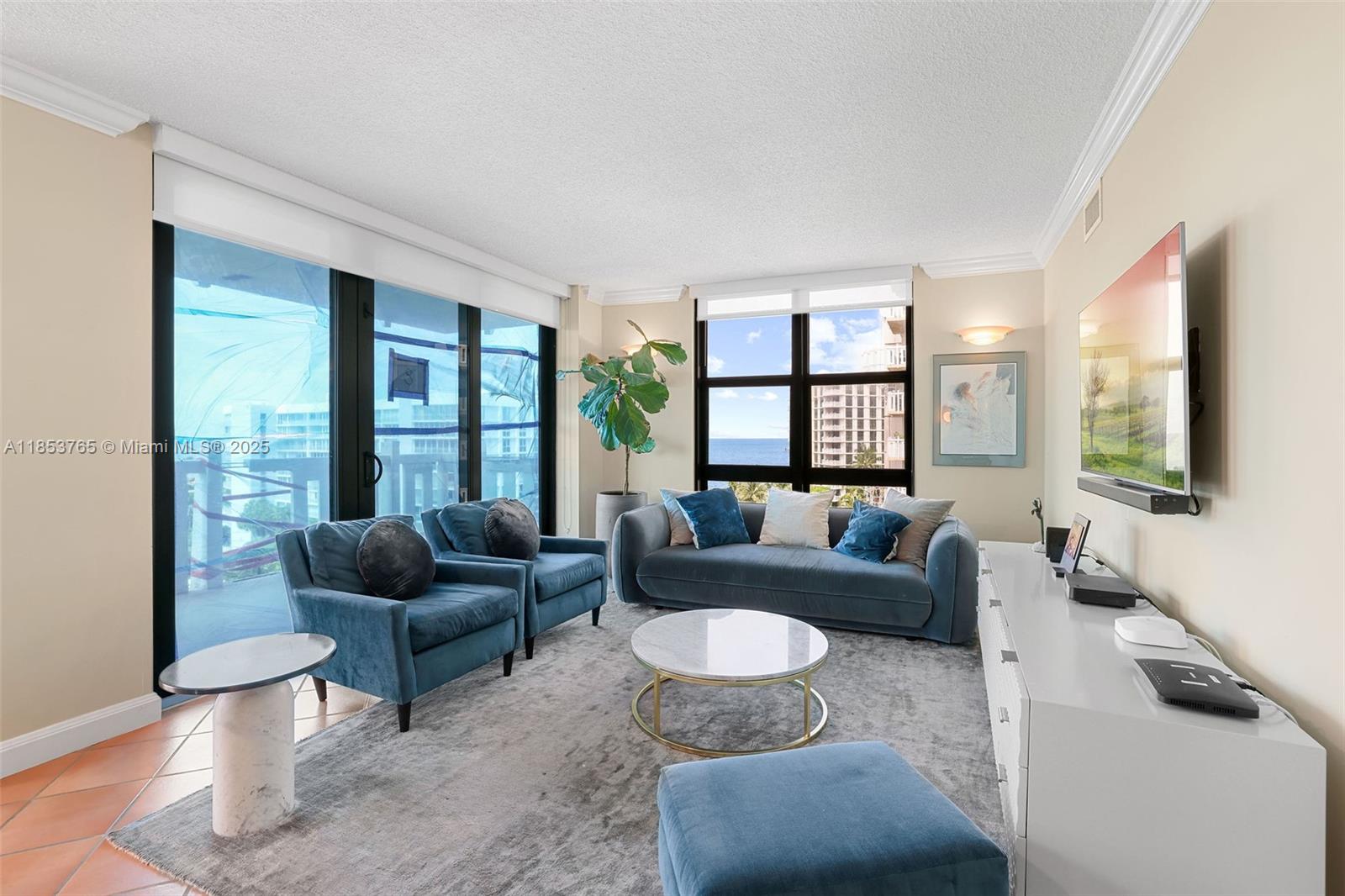 1121 Crandon Boulevard, Unit E802 Key Biscayne, FL 33149 - Photo 5 of 31 a living room with furniture and a large window