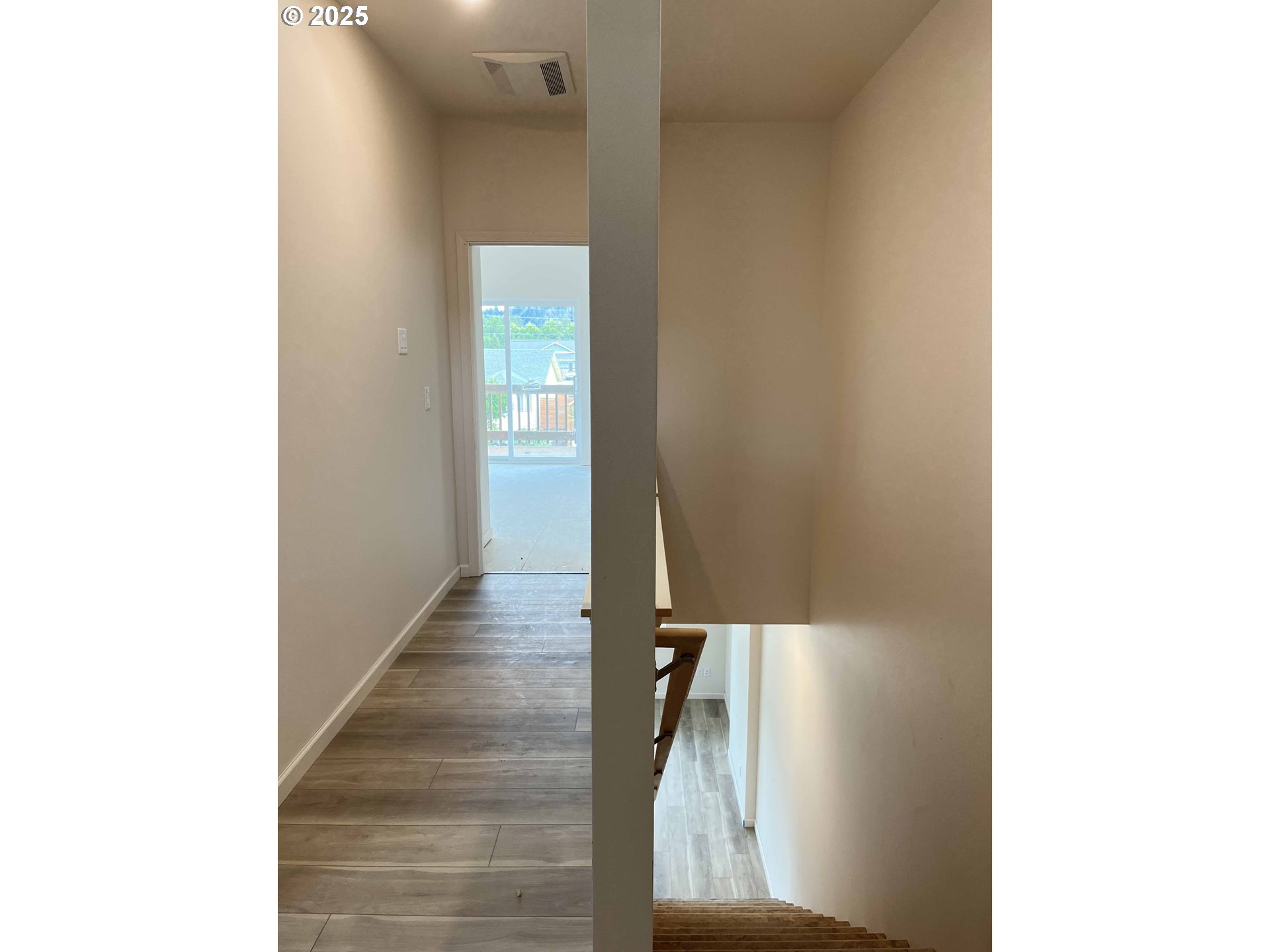 1583 37th Street Florence, OR 97439 - Photo 37 of 48 a view of a hallway with wooden floor