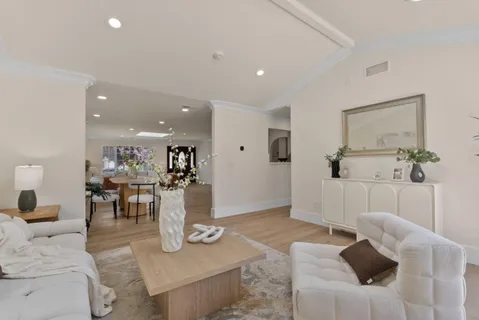 a living room with furniture and a table