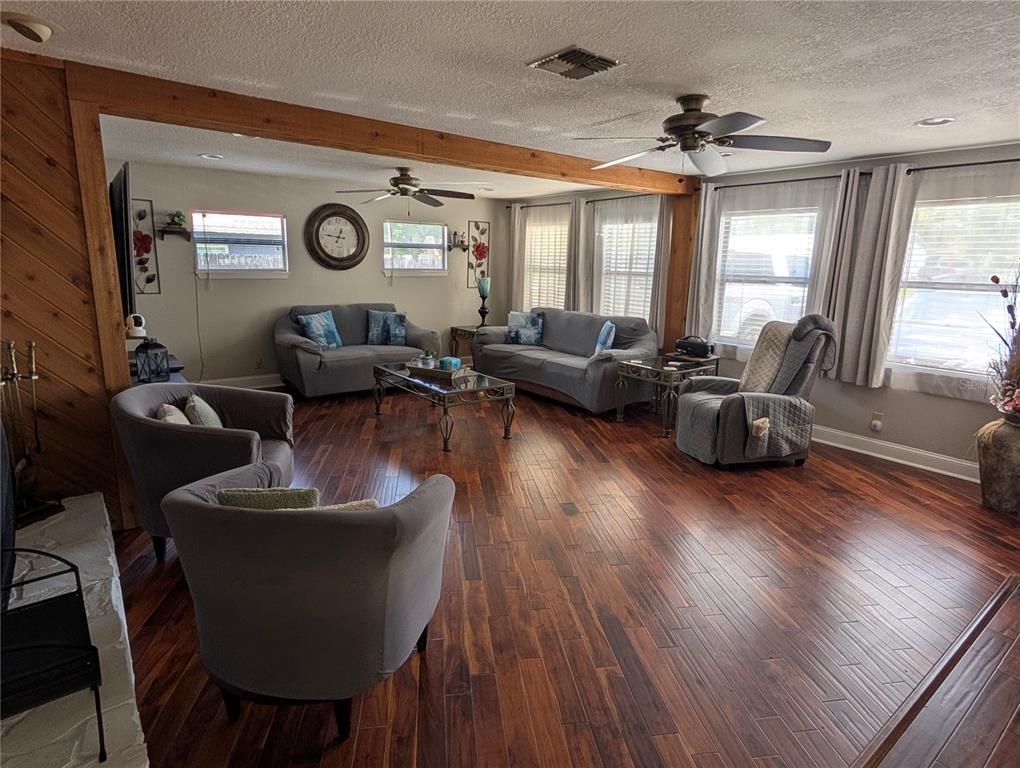 5508 Bryson Drive Orlando, FL 32818 - Photo 12 of 69 a living room with furniture and a large window
