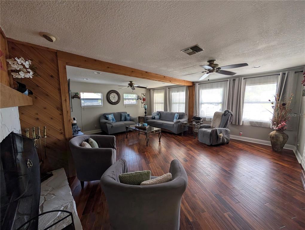 5508 Bryson Drive Orlando, FL 32818 - Photo 16 of 69 a living room with furniture and a wooden floor
