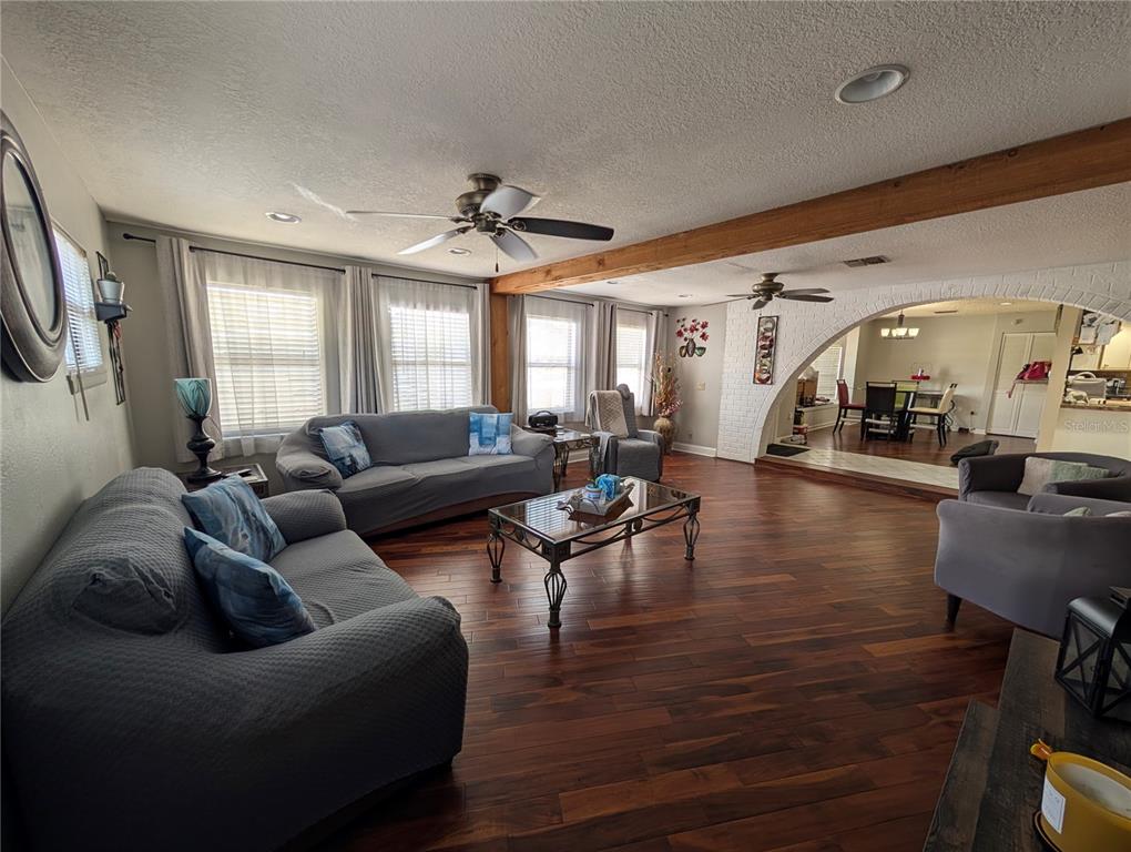 5508 Bryson Drive Orlando, FL 32818 - Photo 17 of 69 a living room with furniture and a large window