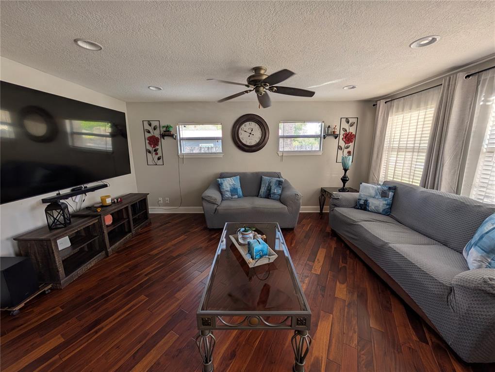 5508 Bryson Drive Orlando, FL 32818 - Photo 18 of 69 a living room with furniture and a flat screen tv