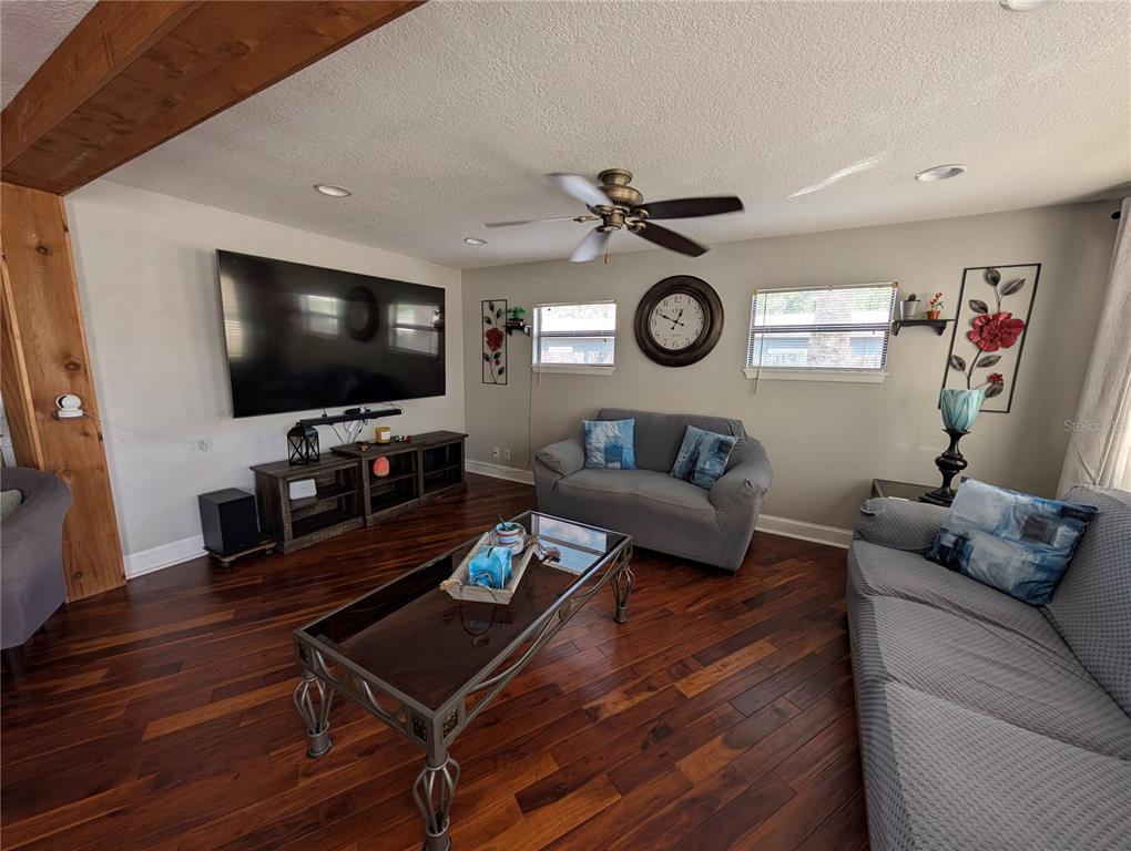 5508 Bryson Drive Orlando, FL 32818 - Photo 19 of 69 a living room with furniture and a flat screen tv