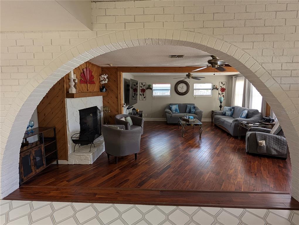5508 Bryson Drive Orlando, FL 32818 - Photo 20 of 69 a living room with furniture and a wooden floor