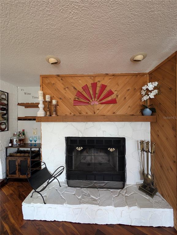 5508 Bryson Drive Orlando, FL 32818 - Photo 21 of 69 a living room with furniture and a fireplace