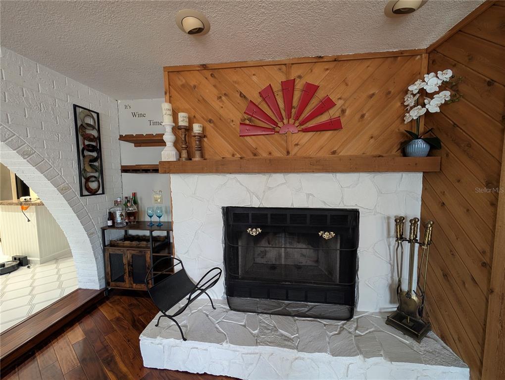 5508 Bryson Drive Orlando, FL 32818 - Photo 22 of 69 a living room with furniture and a fireplace
