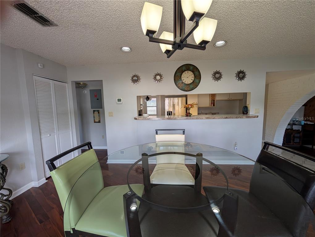 5508 Bryson Drive Orlando, FL 32818 - Photo 30 of 69 a view of a workspace with furniture and a clock