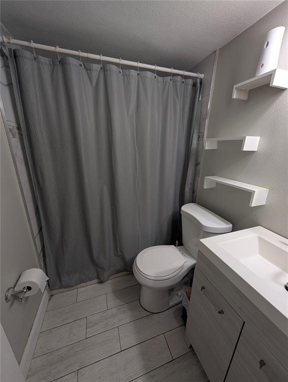 5508 Bryson Drive Orlando, FL 32818 - Photo 48 of 69 a bathroom with a sink toilet and shower