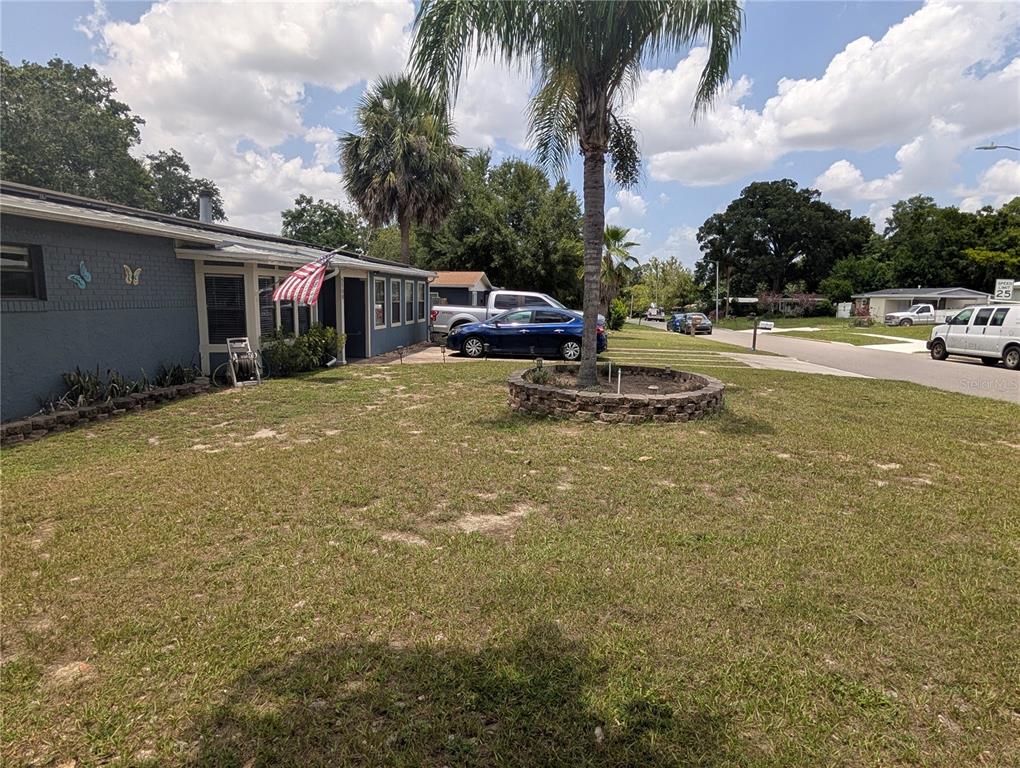 5508 Bryson Drive Orlando, FL 32818 - Photo 5 of 69 a swimming pool with outdoor seating and yard