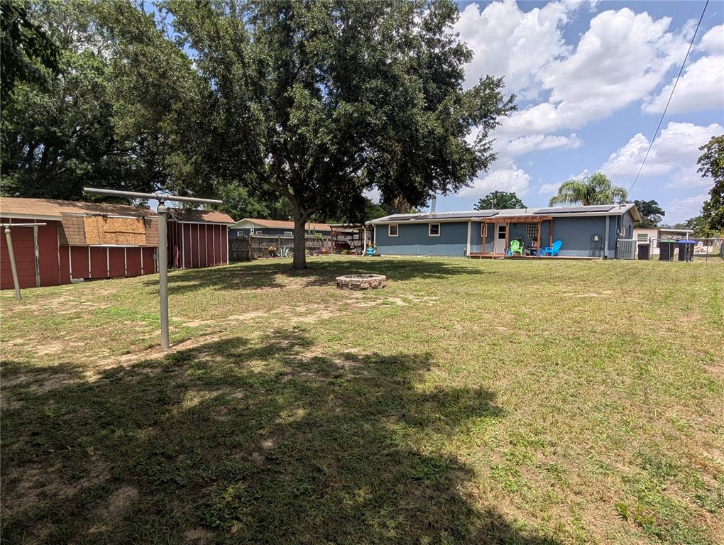 5508 Bryson Drive Orlando, FL 32818 - Photo 60 of 69 a view of a house with a yard