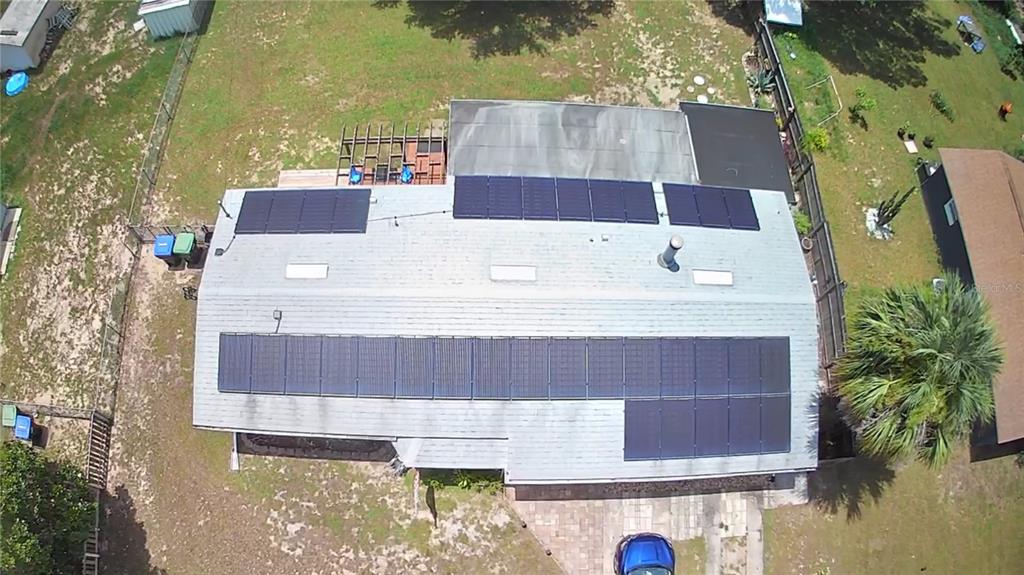 5508 Bryson Drive Orlando, FL 32818 - Photo 6 of 69 a aerial view of a house with swimming pool and large trees