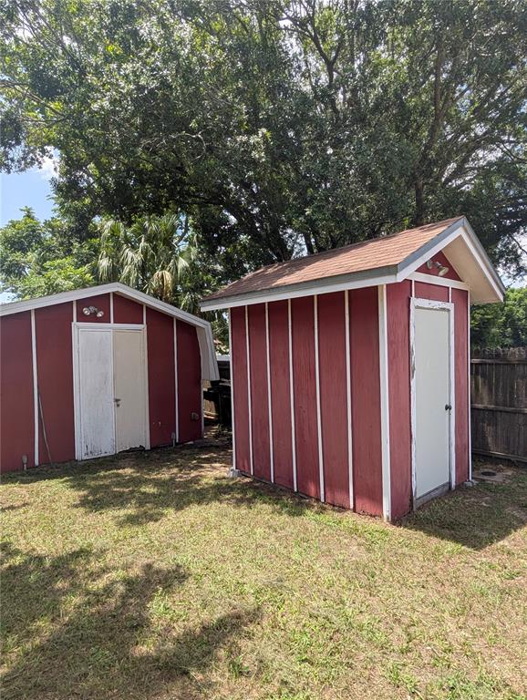 5508 Bryson Drive Orlando, FL 32818 - Photo 64 of 69 a view of a house with a fence and a large tree