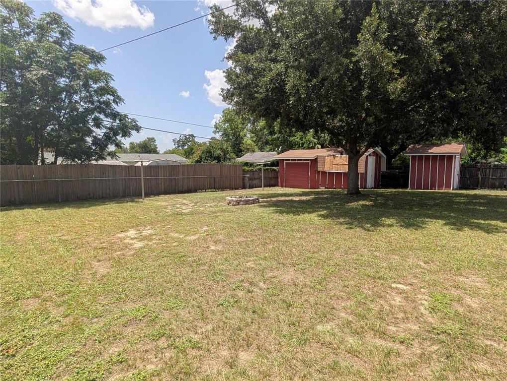 5508 Bryson Drive Orlando, FL 32818 - Photo 66 of 69 a view of a swimming pool with deck and a garden