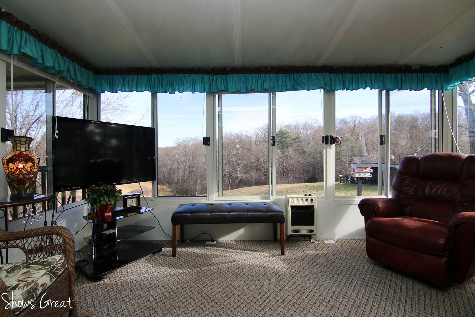 2880 Morgans Mill Road Goodview, VA 24095 - Photo 11 of 34 a living room with a large window and a flat screen tv