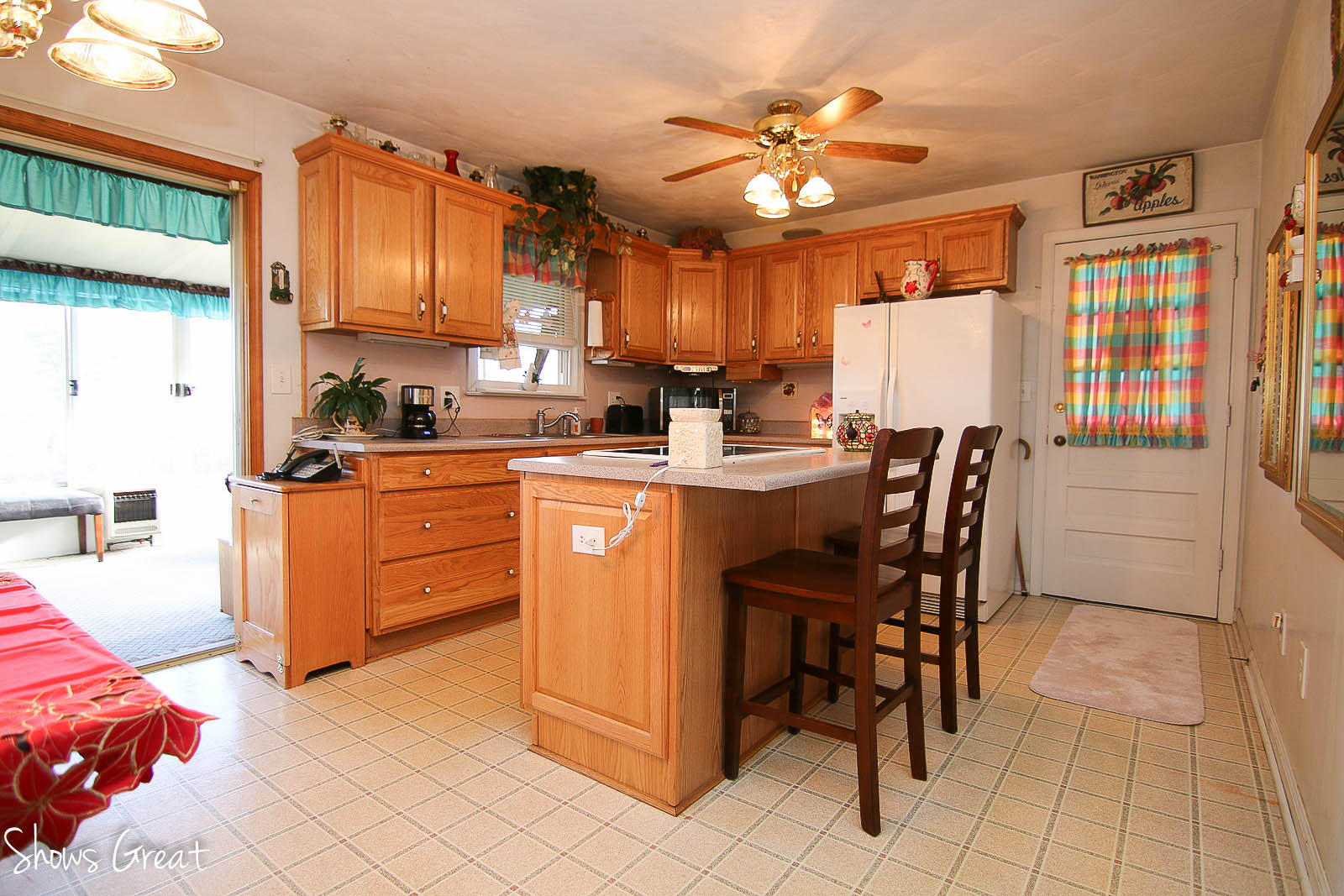 2880 Morgans Mill Road Goodview, VA 24095 - Photo 8 of 34 a kitchen with stainless steel appliances kitchen island granite countertop a sink a stove a dining table and chairs