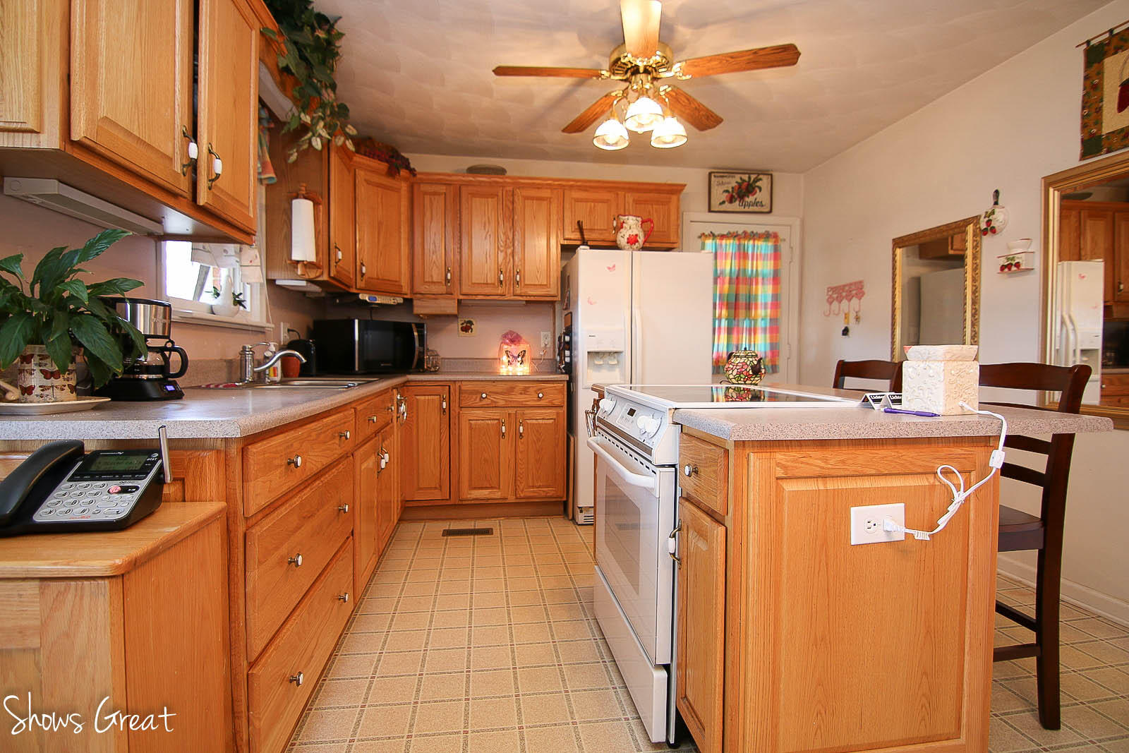2880 Morgans Mill Road Goodview, VA 24095 - Photo 9 of 34 a kitchen with stainless steel appliances a sink a stove a refrigerator cabinets and a dining table