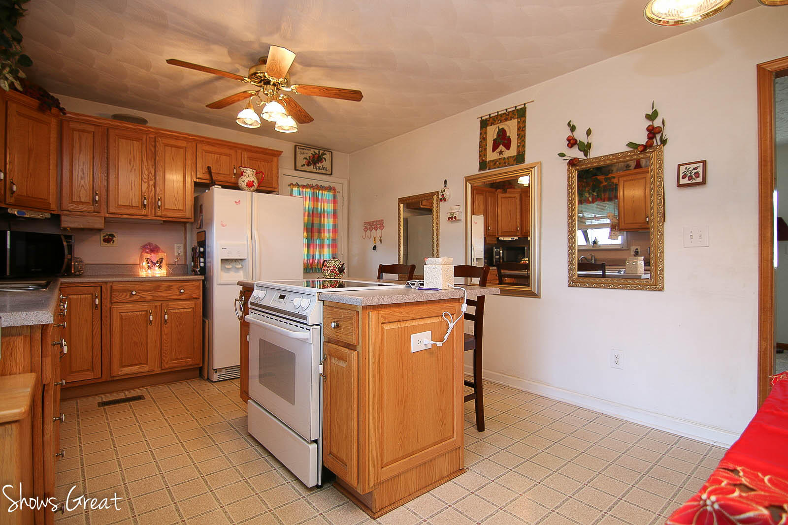 2880 Morgans Mill Road Goodview, VA 24095 - Photo 10 of 34 a kitchen with stainless steel appliances granite countertop a refrigerator a sink dishwasher and a stove with wooden cabinets